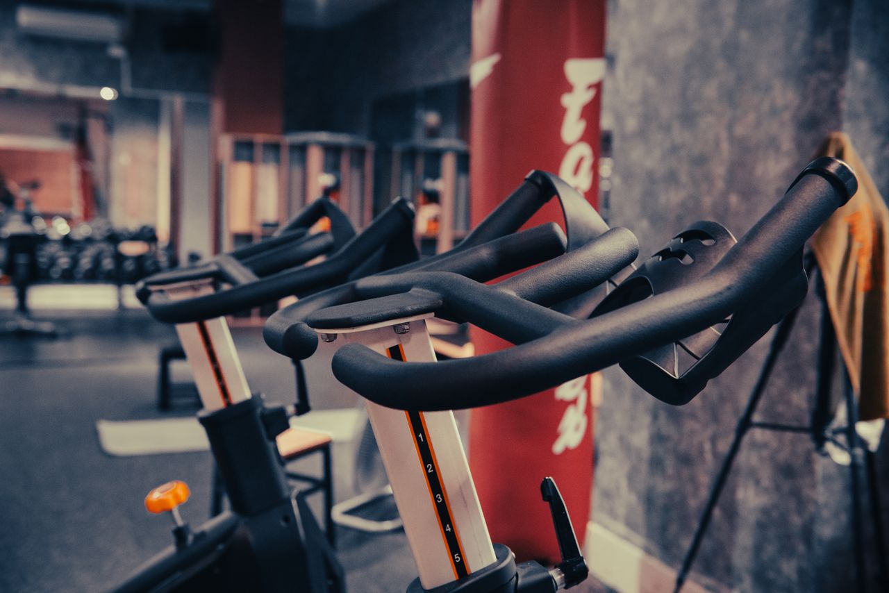 Crafting Captivating Headlines: Your awesome post title goes here Close-up of modern indoor cycling equipment in a contemporary fitness center, highlighting sleek design and functionality.